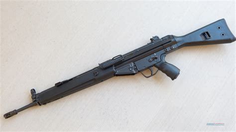 This Pristine Pre-Ban HK91 manufactured in 1980 should grab the attention of serious collectors. There were only 48,819 of these that made it into the country before they were banned by executive order in 1989. This weapon is as clean as I've ever seen one of these. This is the Paratrooper variant of the HK91 but it comes with the Standard Stock, nine original HK G3 mags (as well as 6 common ... 